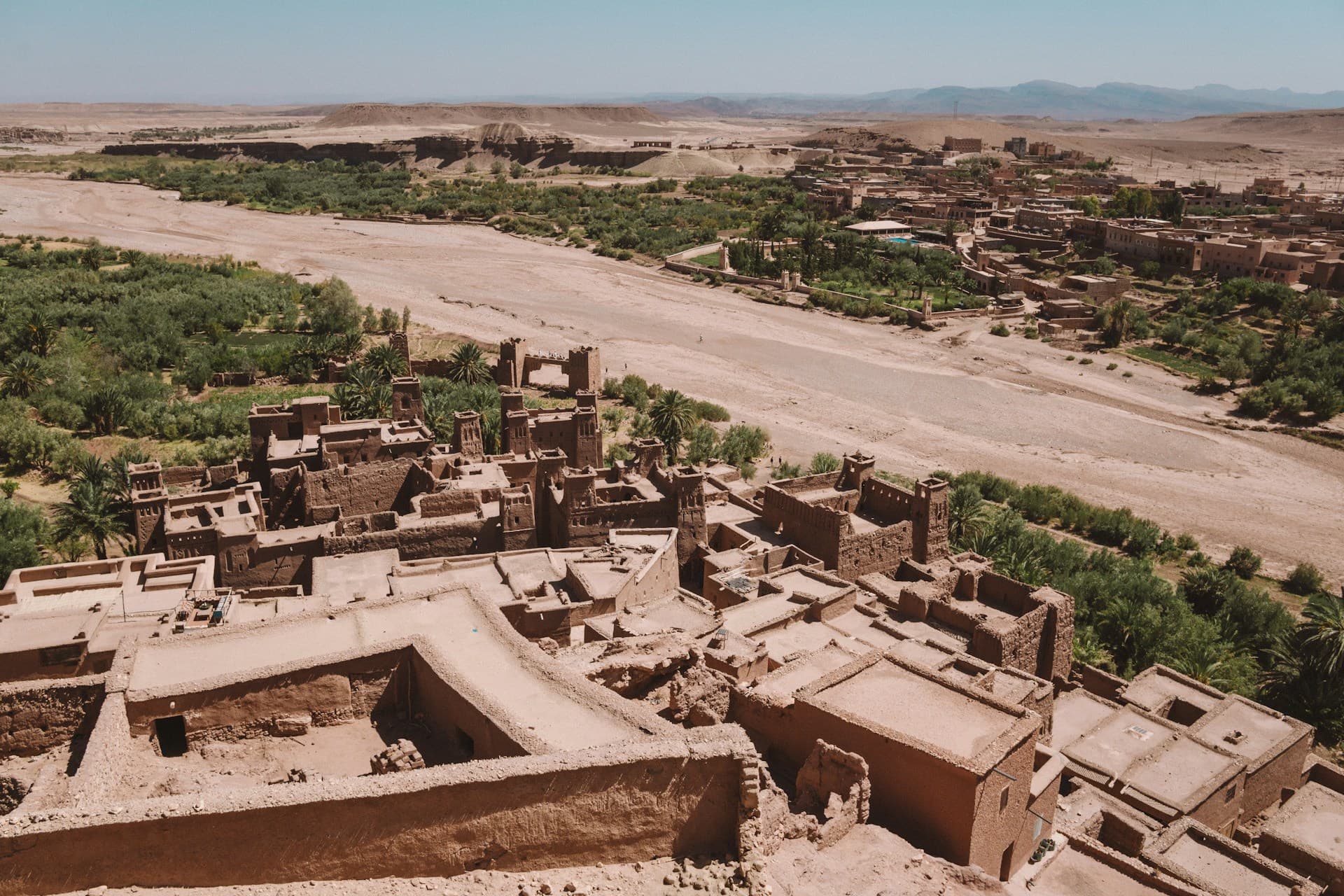 The fortified earthen village of Aït Ben Haddou rising up a hillside in the High Atlas foothills, Morocco